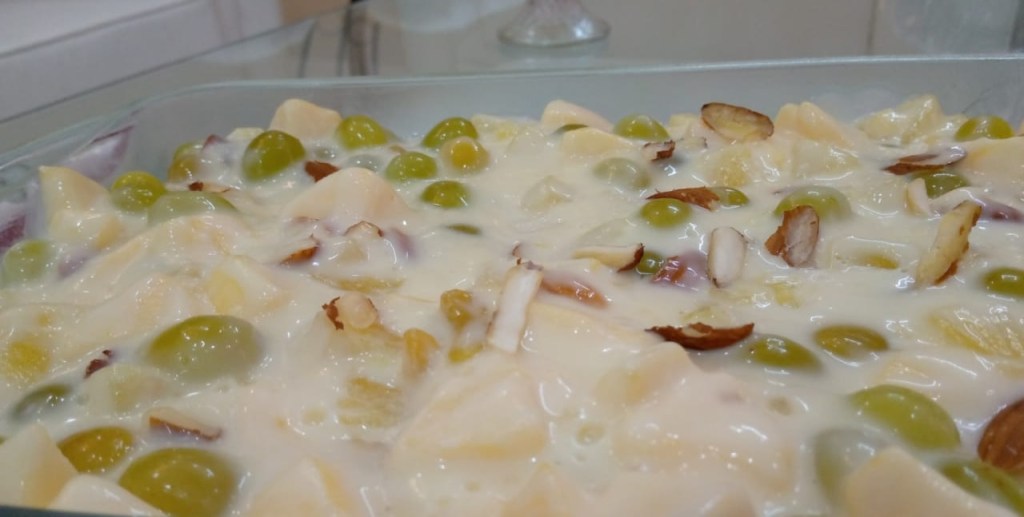 A red and white cake on a plate

Description automatically generated